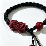 Carved Cinnabar Pixiu Braided Bracelet with Lotus Finials (朱砂精雕貔貅黑编绳手链) thumb
